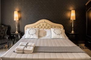 Uma cama ou camas num quarto em Palazzo Bignami