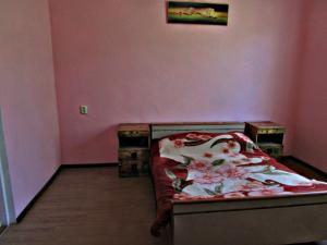 Postel nebo postele na pokoji v ubytování Joni Guest House