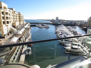 a view of a marina with boats in the water at Lights Landing Apartments in Adelaide