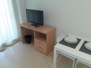 Televízia a/alebo spoločenská miestnosť v ubytovaní Fan Flat Torremolinos