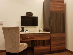 TV a/nebo společenská místnost v ubytování Hotel Sunstar Grand