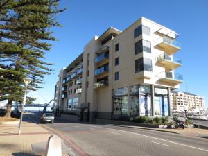 a building on the side of a street at Lights Landing Apartments in Adelaide