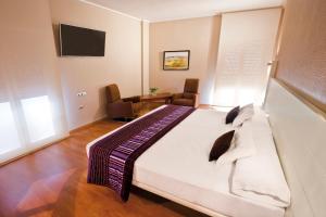 Postel nebo postele na pokoji v ubytování Hotel Fuente El Cura