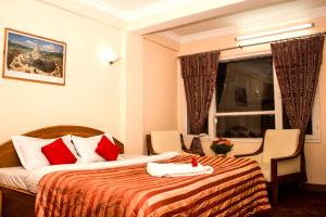 Voodi või voodid majutusasutuse Hotel Kamal toas