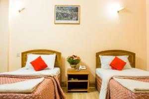 Voodi või voodid majutusasutuse Hotel Kamal toas