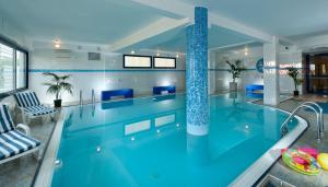 a pool in a house with a swimming pool at Hotel Nord Est in Cattolica