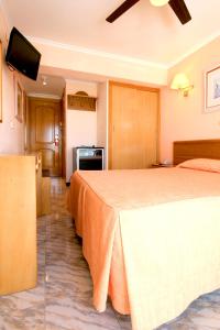 Łóżko lub łóżka w pokoju w obiekcie Hotel Manaus