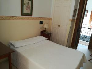 Postel nebo postele na pokoji v ubytování Nuevo Hotel