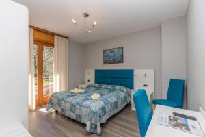 Postel nebo postele na pokoji v ubytování Garnì Casa Rabagno