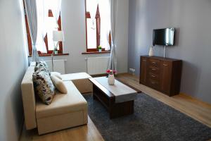 Televízia a/alebo spoločenská miestnosť v ubytovaní Apartamenty Szabla Bydgoszcz