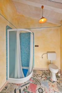 a bathroom with a toilet and a shower at Apartment Sartoria in Prkačini