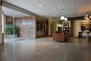 a lobby of a office with a couch and a chair at Hotel Fuente El Cura in Sax