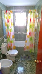 baño con aseo y lavabo y ventana en Holiday Home Eduardo, en Nerja