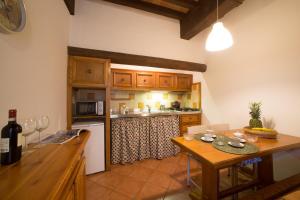 a kitchen with a wooden table and a counter top at Vigna2 - Big 2 bedroom apartment in Florence center in Florence
