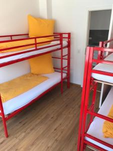 a room with two bunk beds and a mirror at SWISS LOFT by Europa-Park - EP Ticket Garantie in Rust
