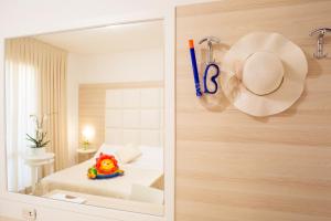 Кровать или кровати в номере Hotel Rosmarina