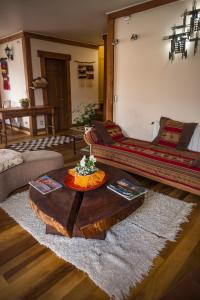 a living room with a couch and a coffee table at Weisserhaus in Puerto Varas