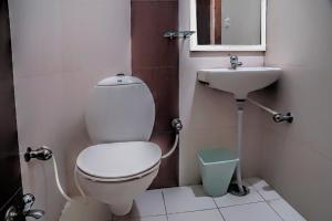a bathroom with a toilet and a sink at Hotel Laxmi Palace in Udaipur +31 photos