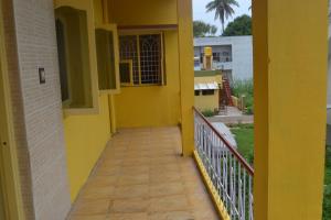 a hallway of a house with a yellow wall at Manasvini Homestay-A home in Mysore with scenic view in Mysore