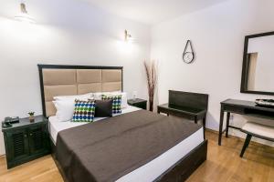 Postel nebo postele na pokoji v ubytování Boutique Hotel Kredo