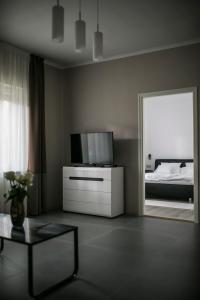 Postel nebo postele na pokoji v ubytování Jázmin Apartman