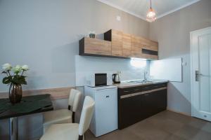 Kuchyň nebo kuchyňský kout v ubytování Jázmin Apartman