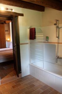 a bathroom with a shower with a glass door at Il Nascondiglio - The Hideaway in Amandola