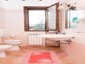 a bathroom with a sink and a toilet at Agriturismo Il Rustico in Marina di Grosseto