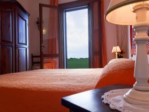 Postel nebo postele na pokoji v ubytování Agriturismo Il Rustico