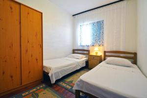 Posteľ alebo postele v izbe v ubytovaní Apartmani Šime