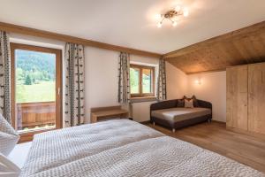 Postel nebo postele na pokoji v ubytování Apartments Foidl