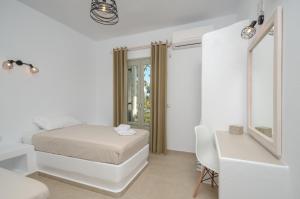 Posteľ alebo postele v izbe v ubytovaní Aphrodite Luxury Apartments