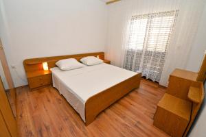 Posteľ alebo postele v izbe v ubytovaní Apartmani Šime