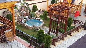 a model of a garden with a swimming pool at Pensiune Matrix in Curtea de Argeş