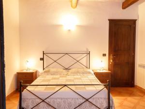 Postel nebo postele na pokoji v ubytování Agriturismo Il Rustico