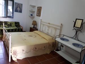Postel nebo postele na pokoji v ubytování Villa Teseo
