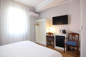 Posteľ alebo postele v izbe v ubytovaní Hostal Los Castañuelos