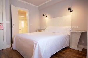 Posteľ alebo postele v izbe v ubytovaní Hostal Los Castañuelos