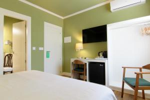 Posteľ alebo postele v izbe v ubytovaní Hostal Los Castañuelos