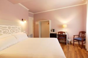 Posteľ alebo postele v izbe v ubytovaní Hostal Los Castañuelos