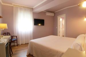 Posteľ alebo postele v izbe v ubytovaní Hostal Los Castañuelos