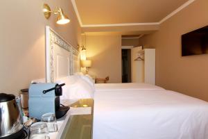 Posteľ alebo postele v izbe v ubytovaní Hostal Los Castañuelos