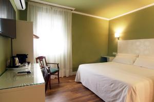 Posteľ alebo postele v izbe v ubytovaní Hostal Los Castañuelos
