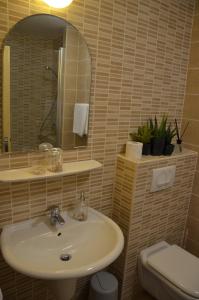 Ein Badezimmer in der Unterkunft Apartments Mango II