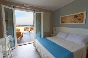 Postel nebo postele na pokoji v ubytování Le Anfore Hotel - Lampedusa