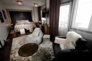 Postel nebo postele na pokoji v ubytování Boutique Hotel Mustaparta