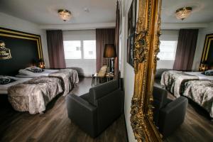 Postel nebo postele na pokoji v ubytování Boutique Hotel Mustaparta