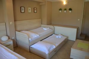 Ein Bett oder Betten in einem Zimmer der Unterkunft Apartments Mango II
