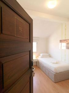 a door leading to a bedroom with a bed at Uporto House Villa in Porto