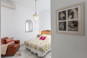 Posteľ alebo postele v izbe v ubytovaní Apartamentos Plaza Pilatos